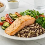 A beautifully arranged plate featuring a lean protein meal, such as grilled salmon with roasted vegetables, presented in a bright and inviting setting that emphasizes health and nutrition.