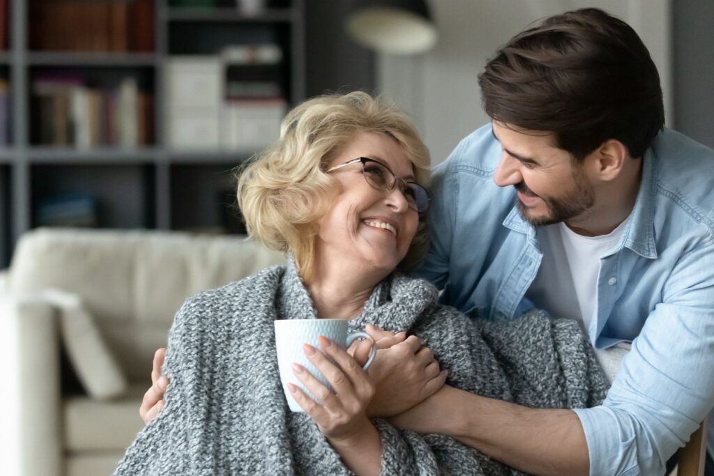 Older adult and family member sharing a warm moment at home, reflecting modern senior living in Chattanooga